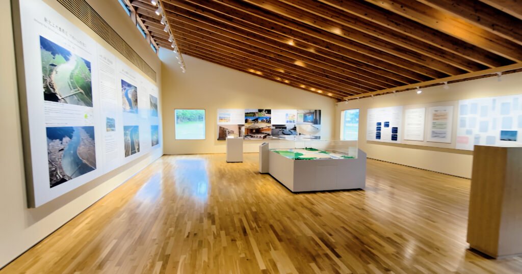 Okawa School Tsunami Memorial – Stories of Hope and Resilience Interior of Okawa Tsunami Memorial Hall exhibition space with photo displays and tsunami education materials.